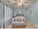 Relaxing bedroom featuring a ceiling fan, modern decor, and natural light from window at 210 Clove Hitch Dr, Salisbury, NC 28677