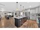 Open concept kitchen with a large island, granite countertops, and stainless steel appliances at 210 Clove Hitch Dr, Salisbury, NC 28677