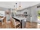 Modern kitchen featuring granite countertops, stainless steel appliances, and a central island at 210 Clove Hitch Dr, Salisbury, NC 28677