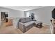 A cozy loft featuring a sectional couch, aquarium, a railing and natural light at 210 Clove Hitch Dr, Salisbury, NC 28677