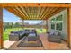 Inviting covered patio featuring stylish furniture and a well-manicured lawn for outdoor relaxation and entertainment at 210 Clove Hitch Dr, Salisbury, NC 28677