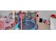 Bright playroom featuring a trampoline and kitchen for imaginative play at 210 Clove Hitch Dr, Salisbury, NC 28677