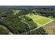 Aerial shot of the property highlighting its wooded and open spaces, marked by property lines at 2159 Quiet Cove Ln, Stanfield, NC 28163