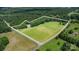 Aerial view of the property showcasing its expansive land, greenery, and home location at 2159 Quiet Cove Ln, Stanfield, NC 28163
