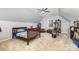 Attic bedroom featuring neutral walls, carpet, bed, exercise equipment and ceiling fan at 2159 Quiet Cove Ln, Stanfield, NC 28163