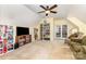 Large bonus room with vaulted ceiling and a wall of built-in shelving at 2159 Quiet Cove Ln, Stanfield, NC 28163
