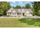 Classic home with a manicured lawn, enhanced by a charming white picket fence at 2159 Quiet Cove Ln, Stanfield, NC 28163