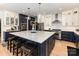 Elegant kitchen showcasing a large island, stainless steel appliances, and stylish pendant lighting at 2159 Quiet Cove Ln, Stanfield, NC 28163