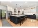 Modern kitchen featuring a spacious island with bar seating and stainless steel appliances at 2159 Quiet Cove Ln, Stanfield, NC 28163