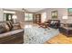Cozy living room featuring hardwood floors, area rug, and comfortable seating at 2159 Quiet Cove Ln, Stanfield, NC 28163