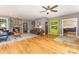 Inviting living room with stone fireplace, hardwood floors, and stylish furnishings at 2159 Quiet Cove Ln, Stanfield, NC 28163