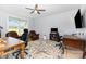 This spacious office has hardwood floors, an oriental rug, and multiple workspaces at 2159 Quiet Cove Ln, Stanfield, NC 28163