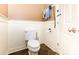 Cozy powder room with a standard toilet, painted walls and tile flooring at 2159 Quiet Cove Ln, Stanfield, NC 28163