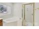 Spacious bathroom featuring a garden tub and glass-enclosed shower at 2321 Oberwood Dr, Charlotte, NC 28270