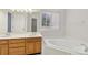 Bright bathroom with a double vanity, garden tub, and a shower at 2321 Oberwood Dr, Charlotte, NC 28270