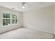 Bright bedroom featuring bright windows and a ceiling fan at 2321 Oberwood Dr, Charlotte, NC 28270