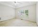 Spacious bedroom with a tray ceiling and bright windows at 2321 Oberwood Dr, Charlotte, NC 28270