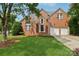Beautiful brick home with a manicured lawn and a two-car garage, perfect for Gathering living at 2321 Oberwood Dr, Charlotte, NC 28270