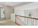 Upstairs view of foyer featuring a chandelier, staircase, and windows overlooking the front door at 2321 Oberwood Dr, Charlotte, NC 28270