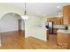 Kitchen with eat-in area adjacent to stainless steel fridge and hardwood floors at 2321 Oberwood Dr, Charlotte, NC 28270