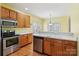 Functional kitchen with stainless steel appliances and wooden cabinets at 2321 Oberwood Dr, Charlotte, NC 28270