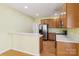 Open-concept kitchen with stainless steel refrigerator and view of dining area at 2321 Oberwood Dr, Charlotte, NC 28270