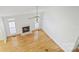 Top-down view of the living room featuring hardwood floors, a fireplace, and multiple windows at 2321 Oberwood Dr, Charlotte, NC 28270