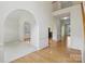 Open living space with archways, hardwood floors, and neutral tones offering a versatile layout at 2321 Oberwood Dr, Charlotte, NC 28270