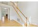 View of staircase featuring hardwood steps and flooring with views of the living room at 2321 Oberwood Dr, Charlotte, NC 28270