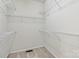 Organized walk-in closet featuring multiple white wire shelving units for efficient storage solutions at 2321 Oberwood Dr, Charlotte, NC 28270