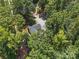 Overhead view of the house surrounded by lots of green trees at 2345 Stallings Rd, Matthews, NC 28104