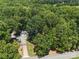 Aerial view of home surrounded by lush trees offering ultimate privacy at 2345 Stallings Rd, Matthews, NC 28104