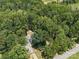 Aerial view of home surrounded by lush trees providing maximum privacy at 2345 Stallings Rd, Matthews, NC 28104