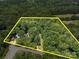 Aerial view of the property featuring a spacious lot surrounded by lush greenery, showcasing its potential at 2345 Stallings Rd, Matthews, NC 28104