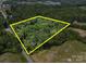 Expansive property with lush green trees, outlined in bright yellow to mark its borders at 2345 Stallings Rd, Matthews, NC 28104