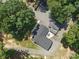 A bird's-eye view of the house featuring a modern roof, an outdoor patio area and green spaces at 2345 Stallings Rd, Matthews, NC 28104