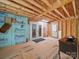 Unfinished bonus room with exposed wood walls and ceiling, french door, door, and styrofoam insulation panels at 2345 Stallings Rd, Matthews, NC 28104