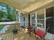Relaxing deck with outdoor furniture, offering a comfortable space to relax and enjoy the beautiful landscape at 2345 Stallings Rd, Matthews, NC 28104