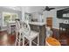 Open floor plan featuring a dining room and kitchen bar with white bar stools at 2345 Stallings Rd, Matthews, NC 28104