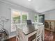 Bright and airy dining room with wood floors, large windows, and a modern table set at 2345 Stallings Rd, Matthews, NC 28104