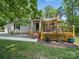 A charming home featuring a wood deck with wooden railings, perfect for outdoor entertaining at 2345 Stallings Rd, Matthews, NC 28104