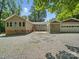 Back of house with patio and detached garage and carport at 2345 Stallings Rd, Matthews, NC 28104