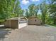 View of house and garage with large door, offering secure parking and storage at 2345 Stallings Rd, Matthews, NC 28104