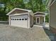 Exterior of a detached one-car garage with white door at 2345 Stallings Rd, Matthews, NC 28104