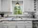 Kitchen featuring granite countertops, white cabinetry, and stainless steel appliances at 2345 Stallings Rd, Matthews, NC 28104