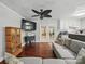 View of the living room showing hardwood floors, neutral walls, and access to other areas at 2345 Stallings Rd, Matthews, NC 28104