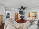 Cozy living room featuring a comfortable gray sectional sofa and hardwood floors at 2345 Stallings Rd, Matthews, NC 28104
