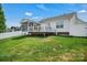 Expansive backyard with a deck and screened in porch that is perfect for entertaining at 2467 Hawk Ridge Dr, Gastonia, NC 28056