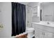 Bathroom featuring a shower with curtain, toilet, sink, and a cabinet at 2467 Hawk Ridge Dr, Gastonia, NC 28056