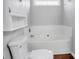 Bathroom featuring a bathtub, toilet, and hardwood floors at 2467 Hawk Ridge Dr, Gastonia, NC 28056